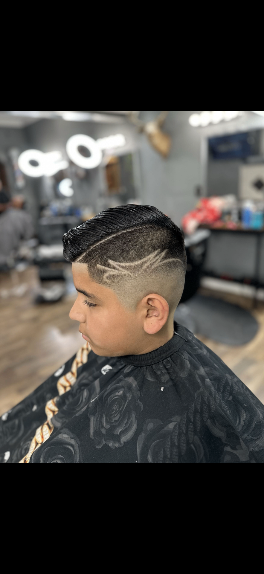 Side part comb over with razor line design