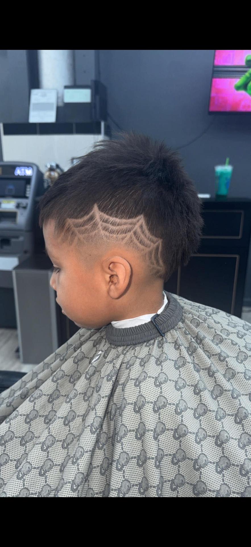 Mullet fade with spider web hair design